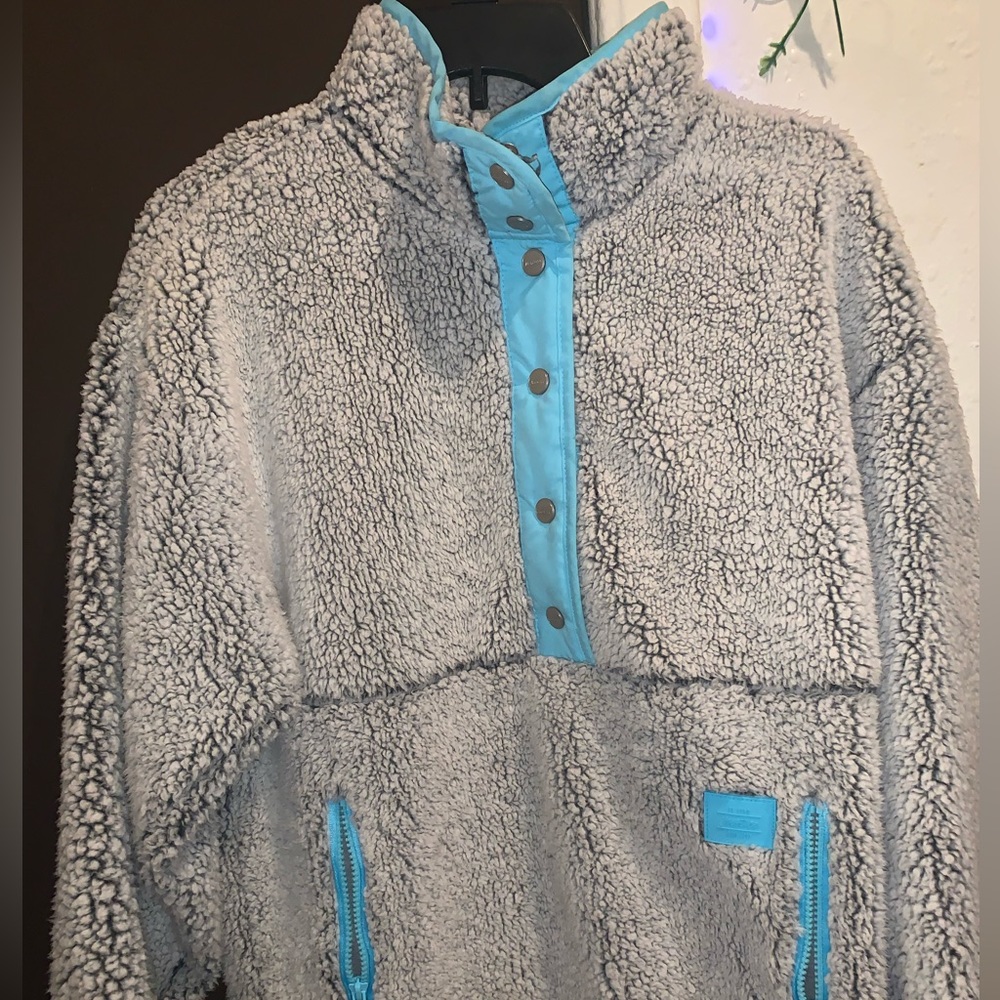 White blue and black fluffy button up jacket